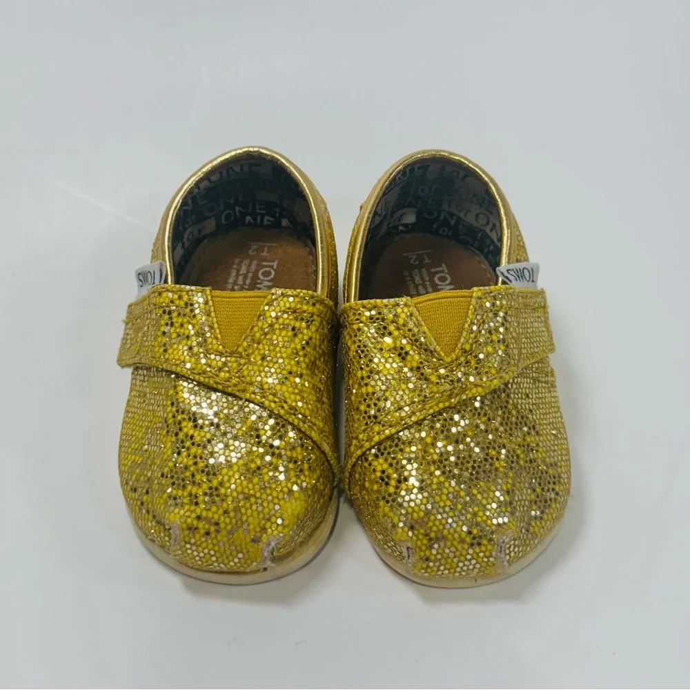 TOMS 2T Yellow Gold Sparkly Toddler Shoes with Velcro Strap.